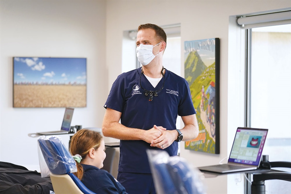 Dr. Wesslen visiting with a patient