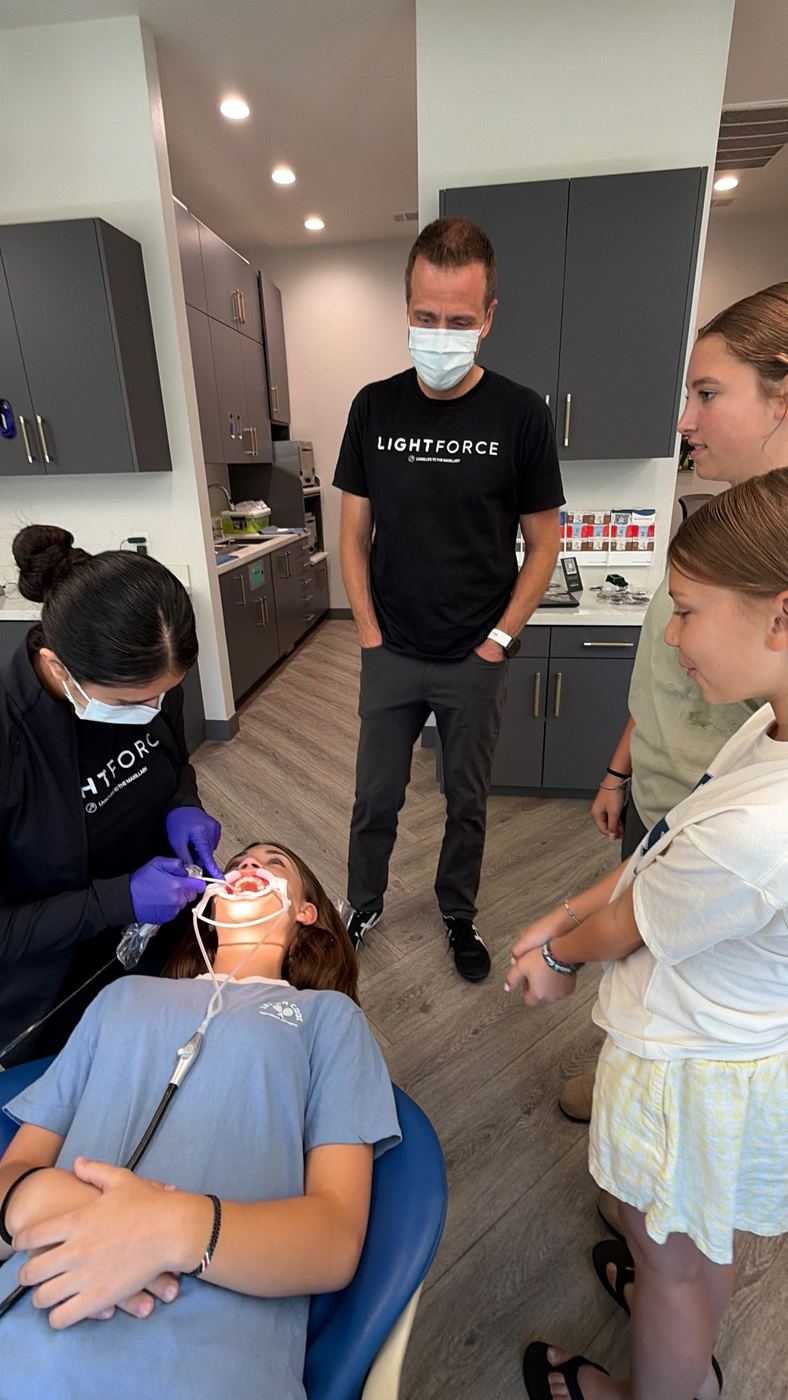 Dr. Wesslen and staff with a family during braces placement